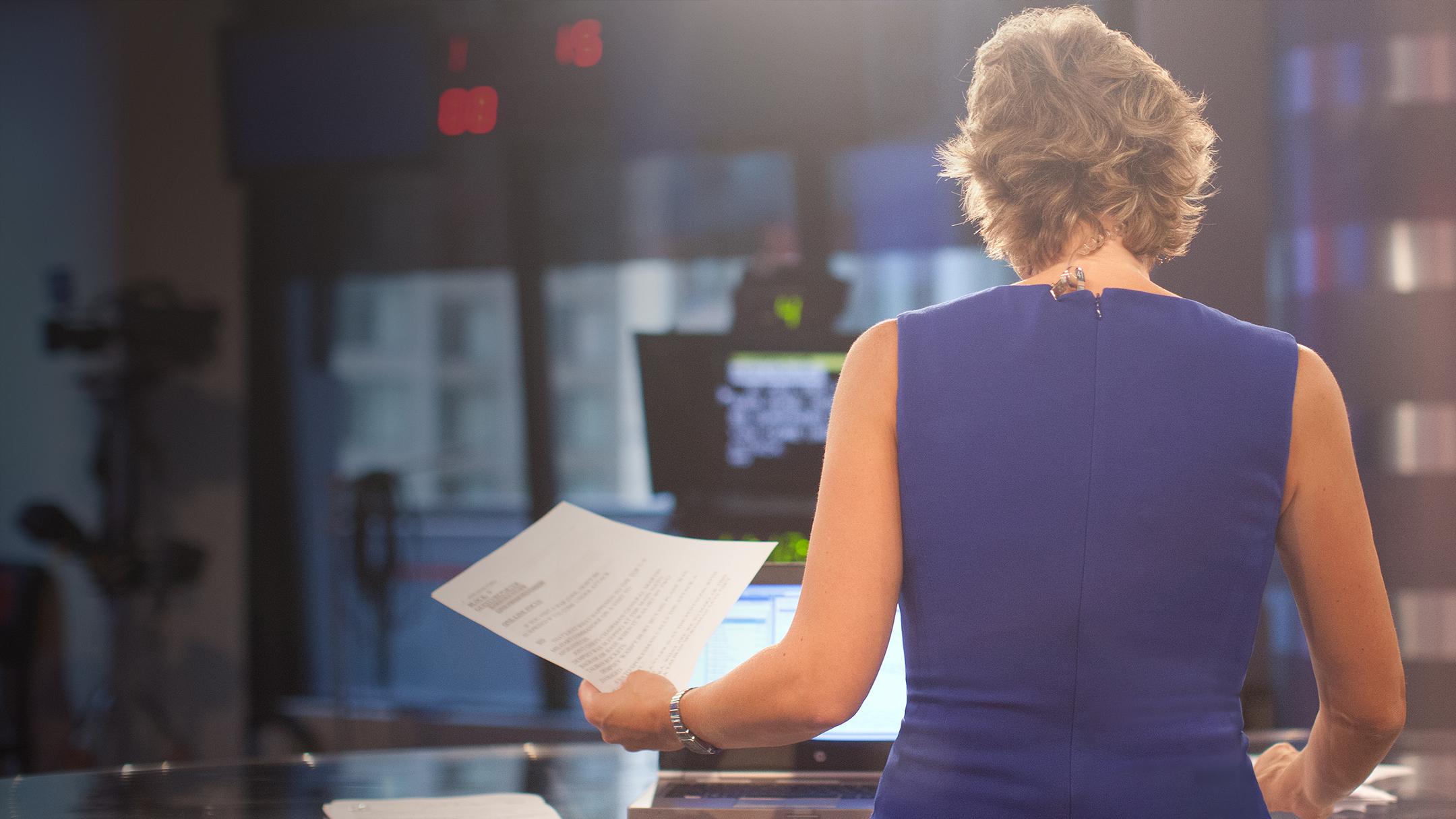 Journalist facing away from camera
