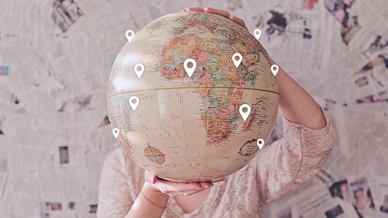 image of person carrying globe